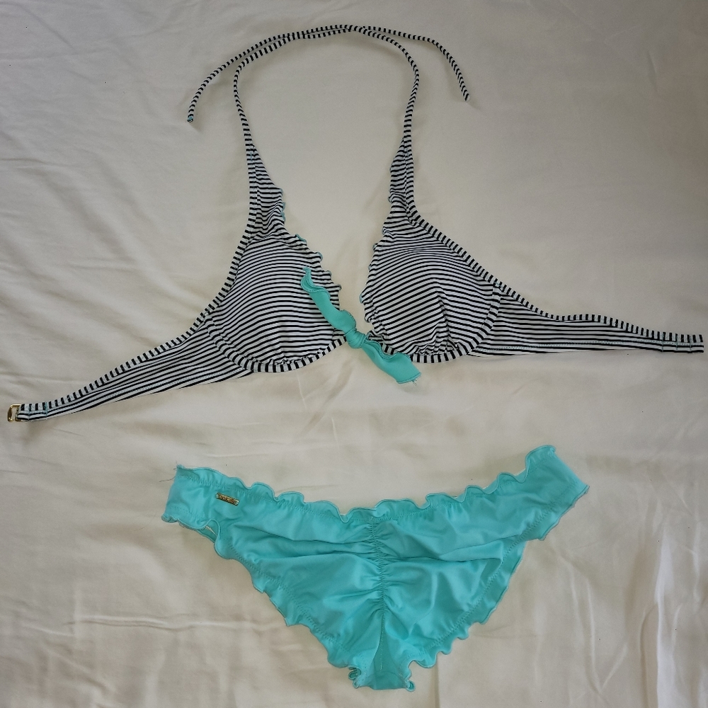 Bathing suit top is 34b bottoms are size small